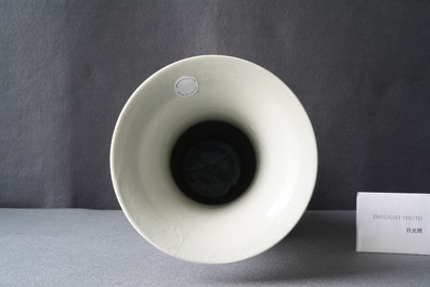 A Chinese famille noire 'magpie and prunus' yenyen vase, Kangxi